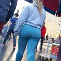 Nerdy blonde in blue leggings