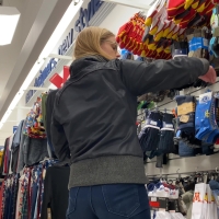 Nerdy blonde in jeans