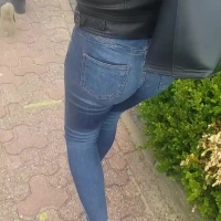 Candid girl in tight jeans