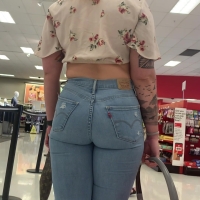 Tattooed hottie in jeans