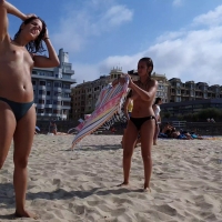 Topless beach friends