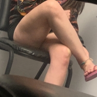 Candid legs under desk