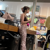 Cute candid clothing store employee with tattoos working in patterned leggings tattoos and pattern leggings.MOV-2023-04-09-13h46m33s167.jpg