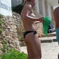 Sexy blonde topless babe
