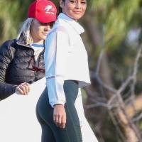 Vanessa Hudgens in green leggings