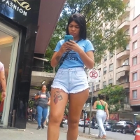 Latina in denim shorts