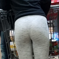 Ass in grey leggings