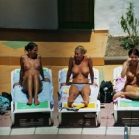 Topless babes at the pool