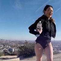 Asian walking in bathing suit