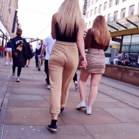 Blonde beauty in beige pants