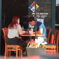 Teen eating in jeans