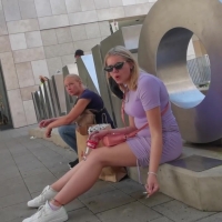 Blonde in purple skirt