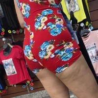 Latina in shorts onesie