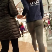 Skinny brunette in grey eleggings