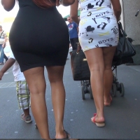 Black milf booty in a tight skirt