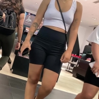 Braless girl in spandex shorts