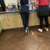 Brunette getting food in Lulus