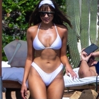 Olivia Culpo in a white bikini