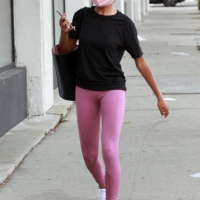 Skai Jackson in pink leggings