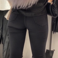 Blonde in black jeans