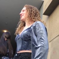Curly haired girl in jeans