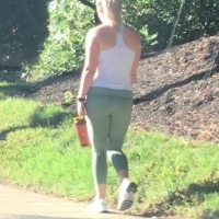 Blonde in green leggings